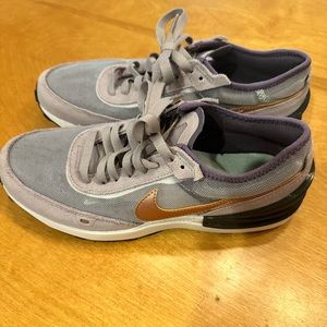 Nike running shoes. Purple and copper.